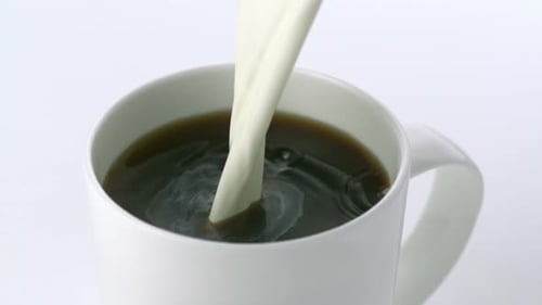 Pouring milk into coffee, Slow Motion