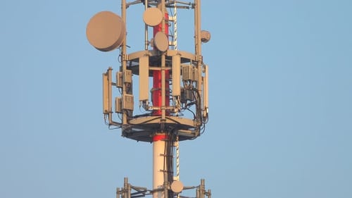 Telecommunications Tower Against Light Blue Sky