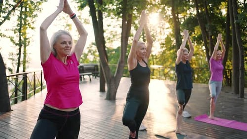 Senior Women Practicing Yoga in Tropical Nature