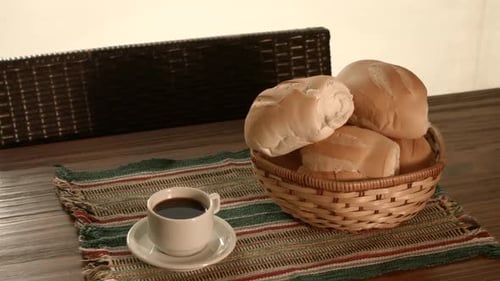 Delicious Bread Rolls with Coffee on Table