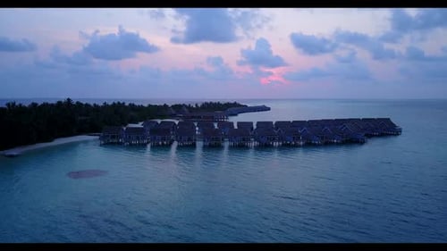 Aerial drone view landscape of idyllic island beach time by turquoise lagoon with clean sandy backgr