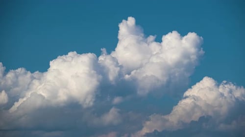 Timelapse of White Puffy Cumulus Clouds Forming on Summer Blue Sky