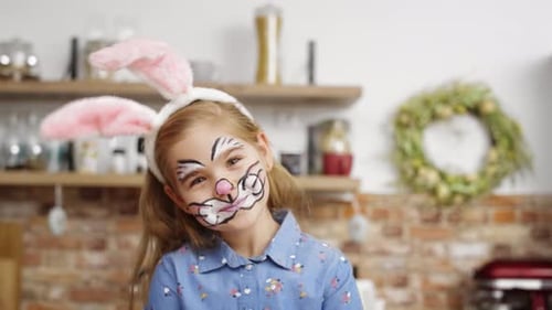 Portrait video of cute playful girl dressed as easter bunny. Shot with RED helium camera in 8K