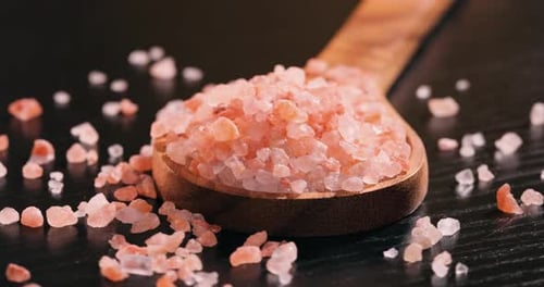 Pink Himalayan Salt in a Wooden Spoon