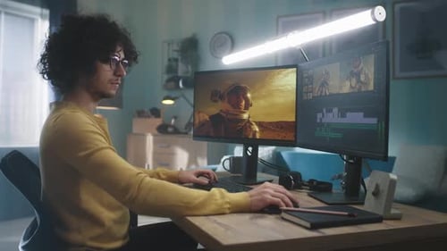 Man Editing Video at Home
