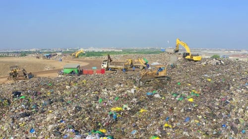 Aerial view of stack of different types of large garbage pile, plastic bags, and trash