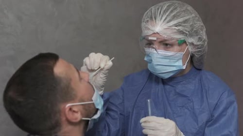 A medical worker takes a corona virus sample for PCR at a hospital.
