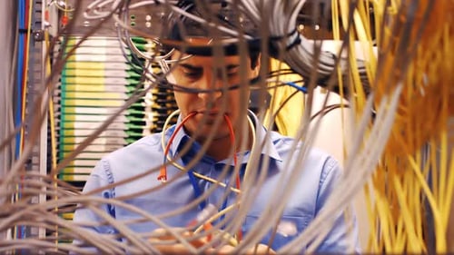 IT Technician Working with Server Wires
