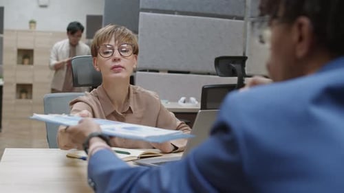 Business Meeting Presentation in Modern Office