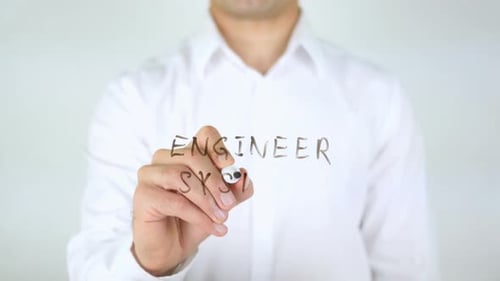 Engineer Writes System on Clear Surface