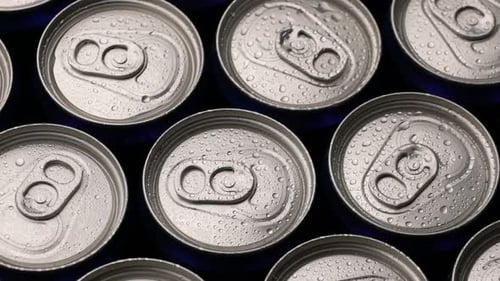 Refreshing Soda Cans with Water Droplets Close Up