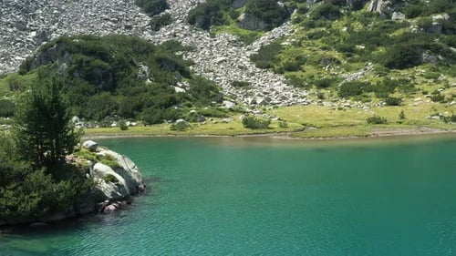 Flight Low Over The Water On A Mountain Lake