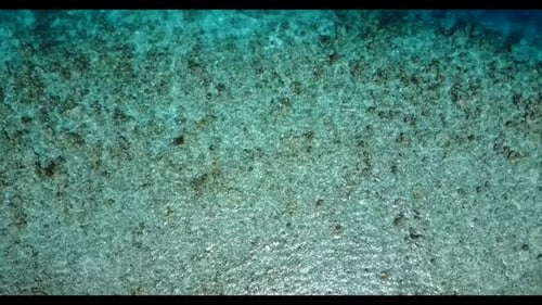 Aerial texture of tranquil tourist beach trip by aqua blue ocean and white sandy background of journ