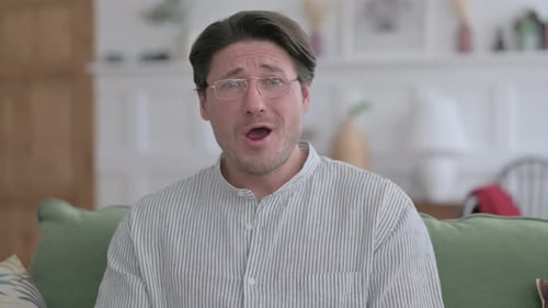 Man Displays Sad Emotions in Home Interior