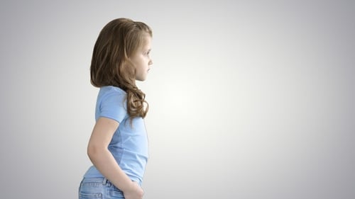 Little cute child smiling in casual and walking on gradient