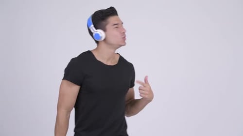 Cheerful Man Dancing with Headphones