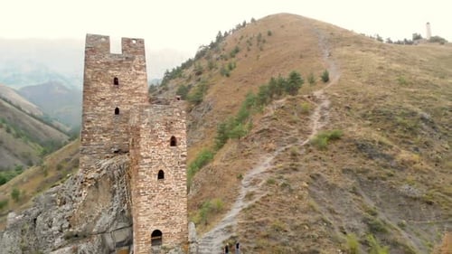 Shooting with Quadrocopter Shooting an Old Castle on Mountain and Path To It. Old Abandoned Tower on