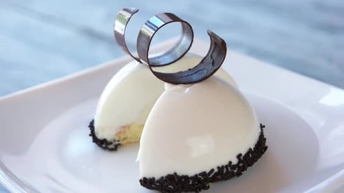 Delicious Dessert with Chocolate Swirls on a Plate