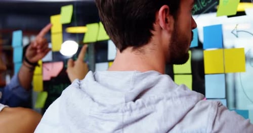 Creative Team Collaborates on Project in Modern Office