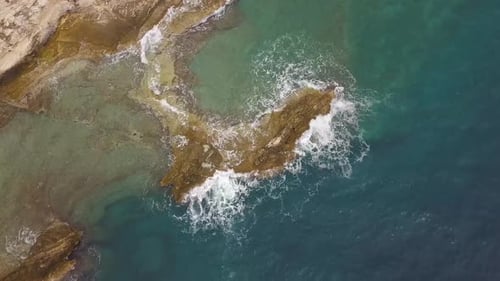 The Waves Break On The Rocky Peninsula
