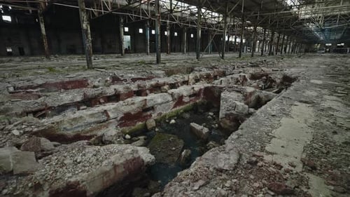 Holes in Floor After Missile Strike on Large Factory