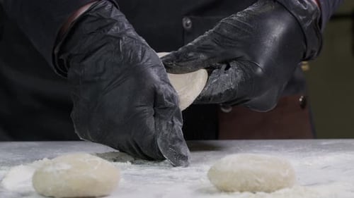 Closeup Shot Hands Black Gloves Bakery Chef Applying Flour Dough Isolated Background Footage