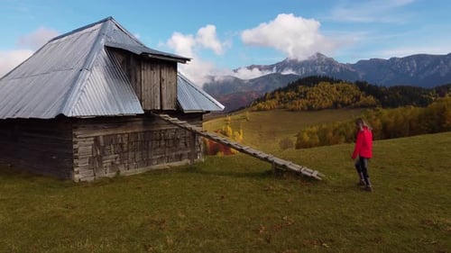 Country Girl Walking Close to a Barn During Autumn on a Sunny day