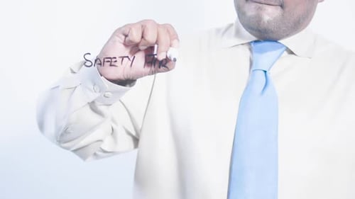 Asian Businessman Writes Safety First