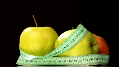 Apple Collection with Measuring Tape, Rotation, Reflection, on White, Close Up