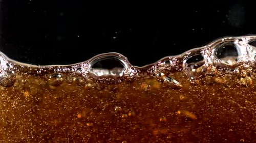 Close Up of Bubbly Brown Liquid