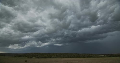 Dramatic Storm Clouds Over Rural Landscape