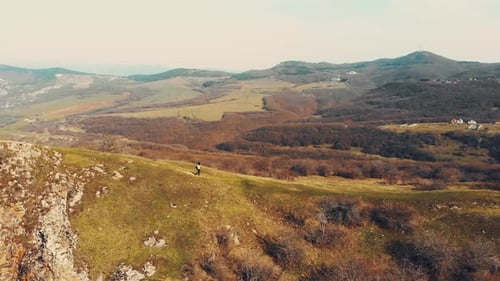Tracking View Woman Hiking Solo Downhill In Beautiful Pristine Nature
