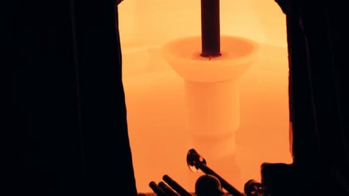Close-up of a piece of glass heated in furnace