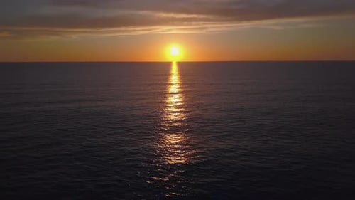 Aerial View Drone Flying Over Sea Surface in Evening Sun Light, Golden Hour Sunset, Cinematic Shot