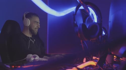 Player in Headphones Wining Online Shooter