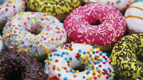 Colorful Assortment of Doughnuts with Various Toppings