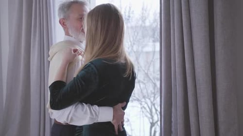 Couple Embraces, Dances in Modern Home