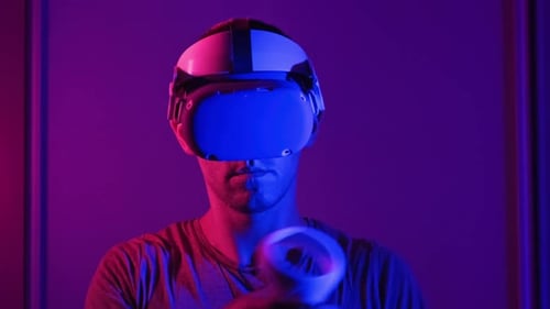 Young Adult Plays VR Game with Headset