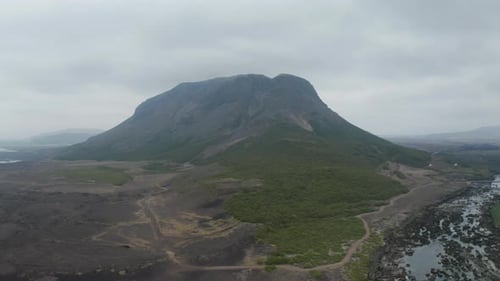 Aerial View of Mountain and River on Cloudy Day