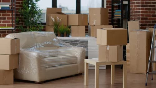 Cardboard Boxes Stacked on Furniture in Home Interior