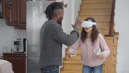 Woman Enjoys VR Game with Friend