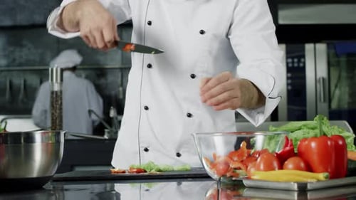 Chef Preparing Vegetables in a Professional Kitchen