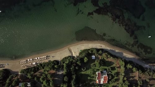 Flying Over Sea Coast Resort. Sunbeds at the Beach and Villa on Seafront