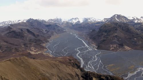 Man standing on top of mountain looking at the view
