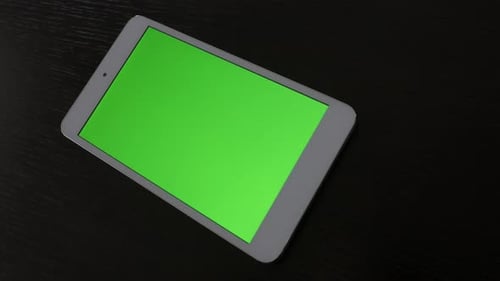 Tablet PC with green screen display on wooden table 4K 2160p UltraHD footage - Silver PC tablet com