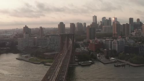 Flight Over Brooklyn Bridge with Moving Car Traffic Sunrise Morning Light Towards Brooklyn