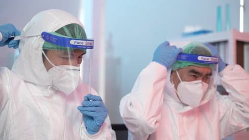 Medical Professionals Preparing in a Laboratory