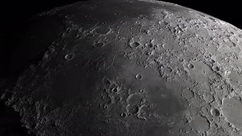 close-up of the moon. flight of the camera along the surface of the moon dotted with craters