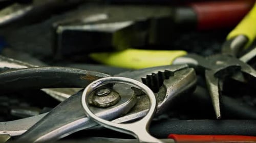 Close-up of Assorted Metal Tools Pliers and Scissors