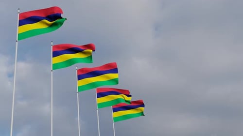 Waving Mauritius Flags on Poles in Blue Sky